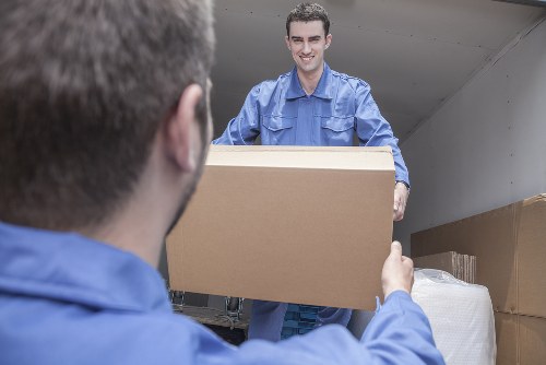 Van loading safely with moving equipment and protective materials