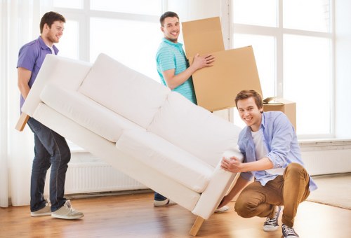 Removal van service with furniture being prepared for transit