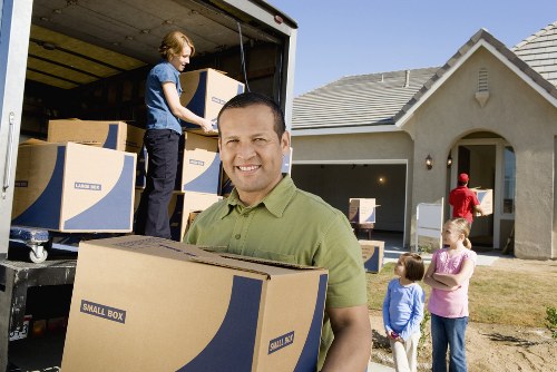 Professional movers handling furniture and household items during a Finsbury Park move